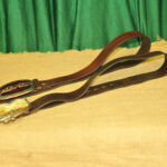 a pair of vintage collectible dsquared leather belts