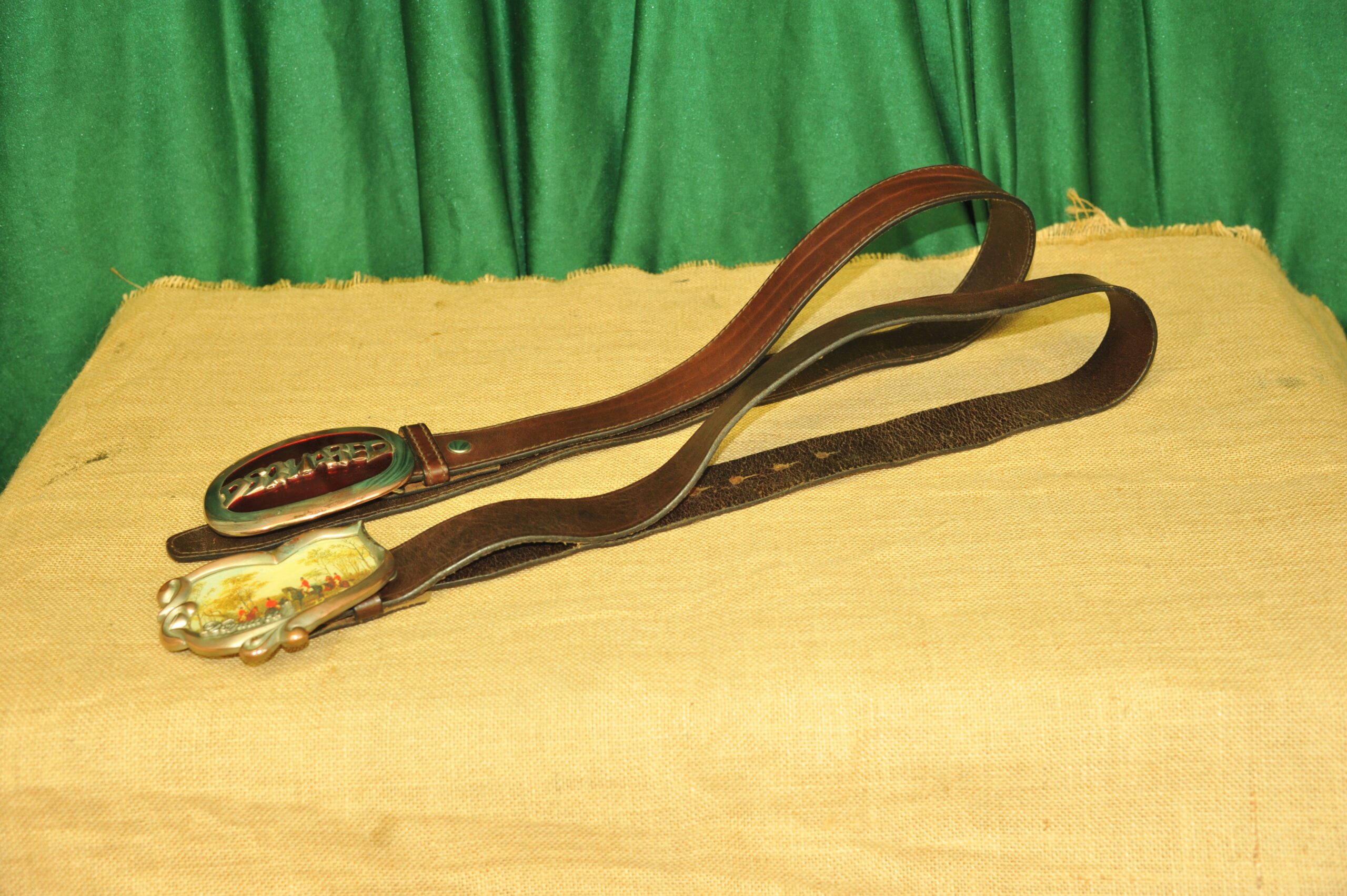 a pair of vintage collectible dsquared leather belts
