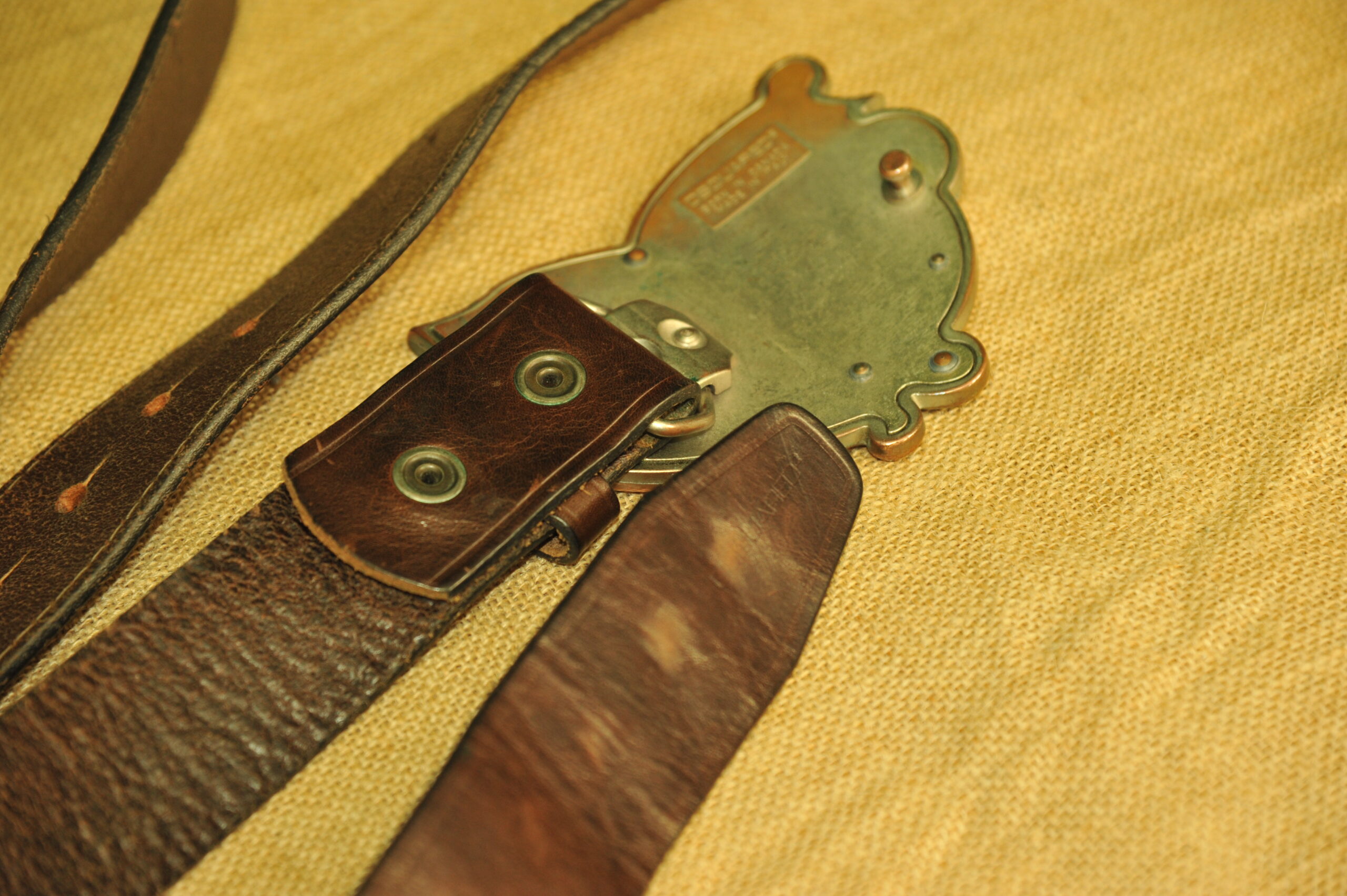 a pair of vintage collectible dsquared leather belts